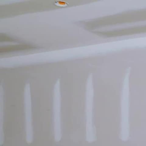 Interior ceiling and taped seams, where a roof leak first shows as a stain